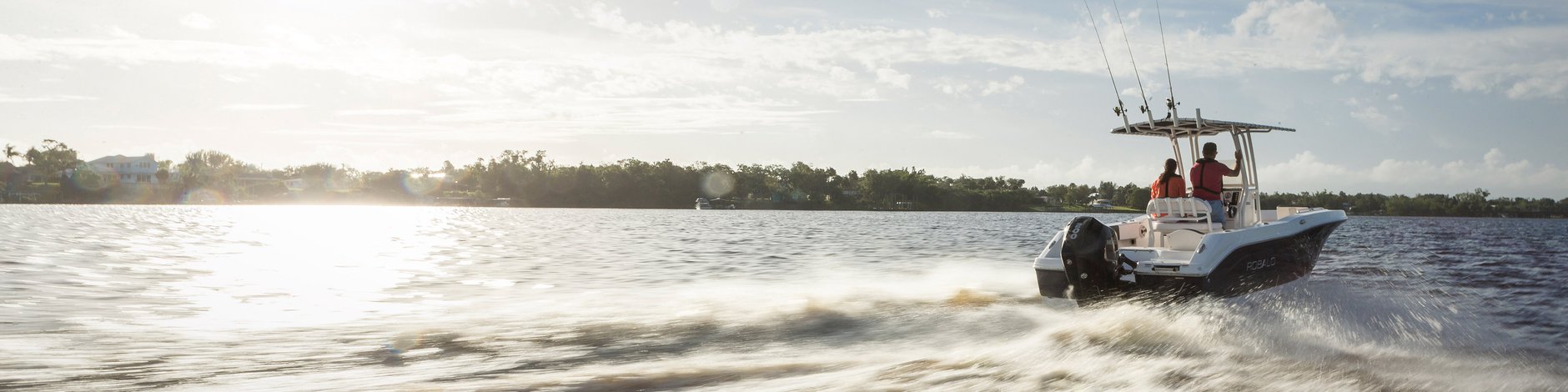 Anglers cruising at high speed with a Mercury outboard motor in the open waters